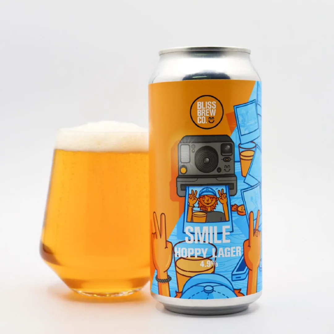 Can of Bliss Brew Co Smile Hoppy Lager, 4.9%, beside a full glass of golden lager